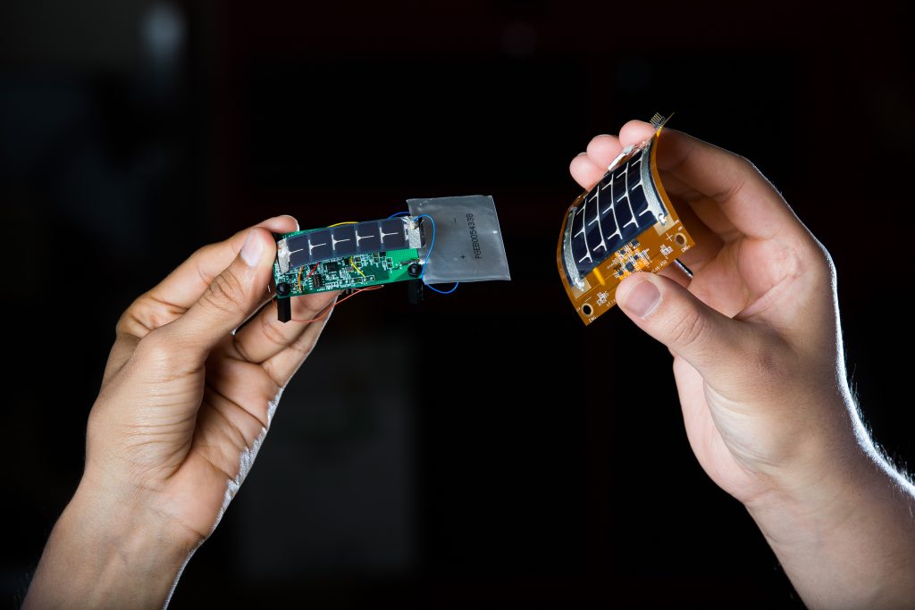 hands holding computer pieces
