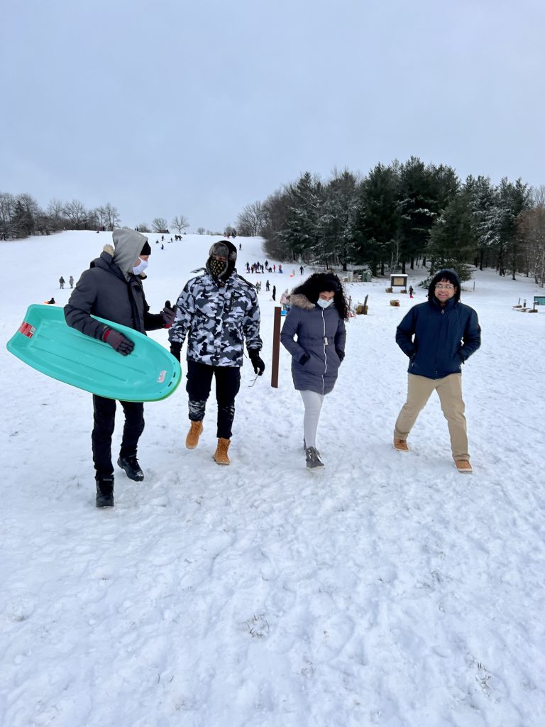 group of people sledding